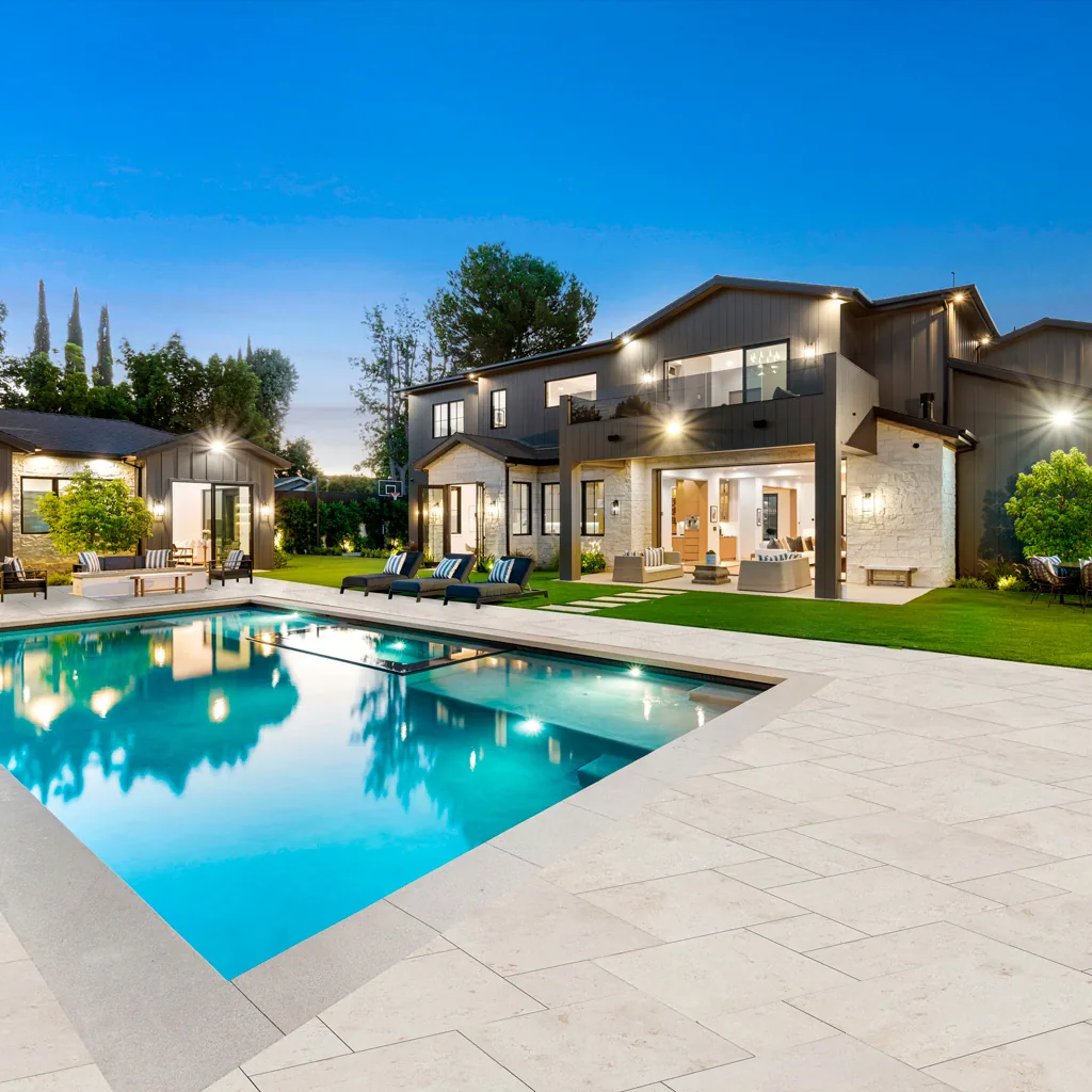 Shell Beige Limestone pool deck at dusk